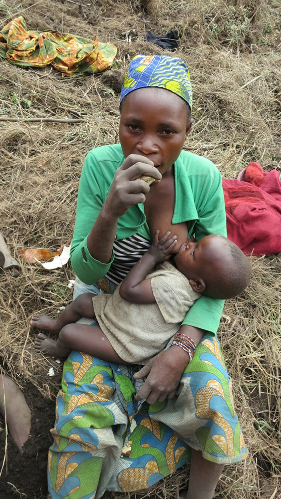 Agriculture Project: Mother and child rest in the field